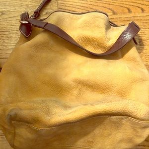 Dooney &Burke Suede Leather bag needs a cleaning